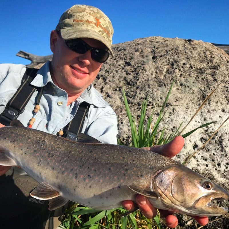 Holding a big catch in the Deschutes River